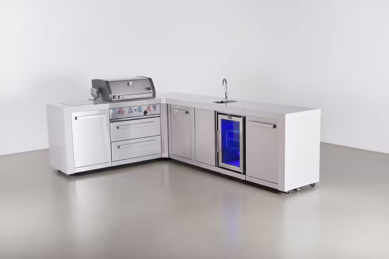 Outdoor kitchen setup with grill, sink, and refrigerator on a white background
