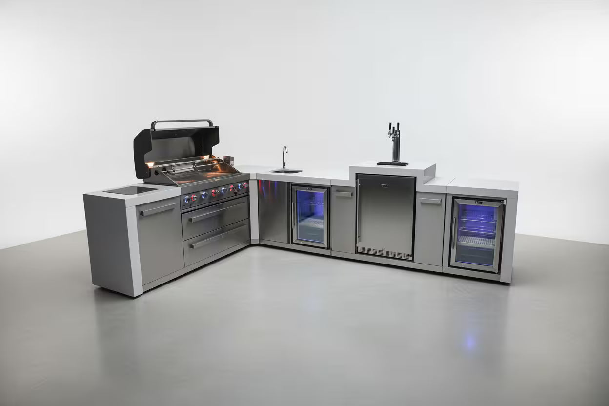 Modern outdoor kitchen with grill, sink, and refrigerator on a white background