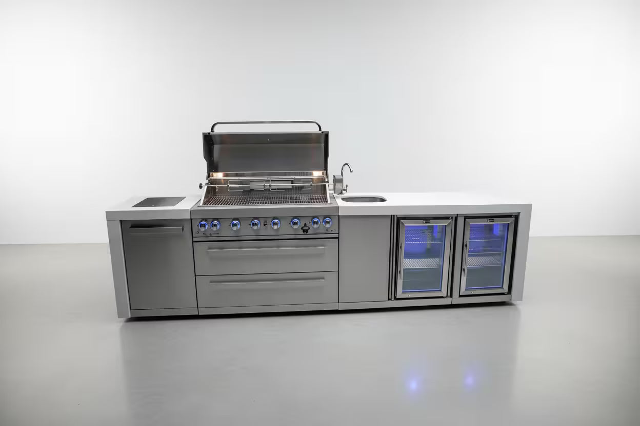 Stainless steel outdoor kitchen island with grill and refrigeration units on a white background